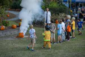 kids watching science experiment at NHC Arboretum