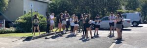 Students in parking lot studying permeable pavement