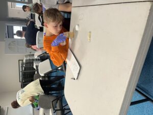4-H Member measuring out water for solution