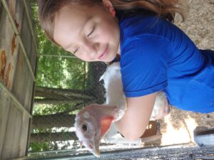 youth holding turkey