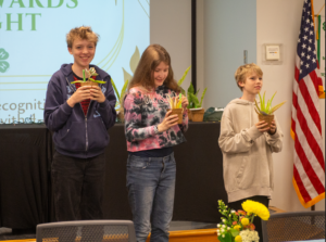 three 4-H youth receiving their awards