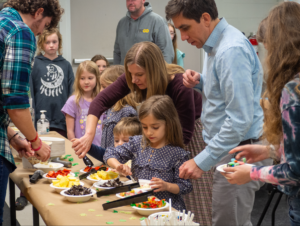 families making their bowls at the ice-cream social