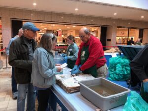 volunteer workers at tree fest in mall in Wilmington NC