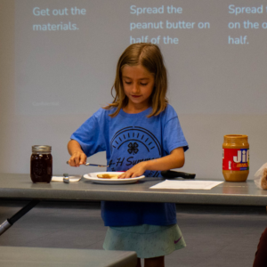 4-H youth preseting the best way to make a PB & J