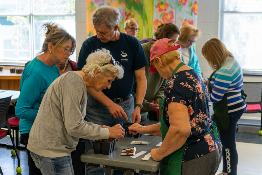 Extension Master Gardener volunteer assisting with Seed Starting Workshop for Consumer Horticulture Program